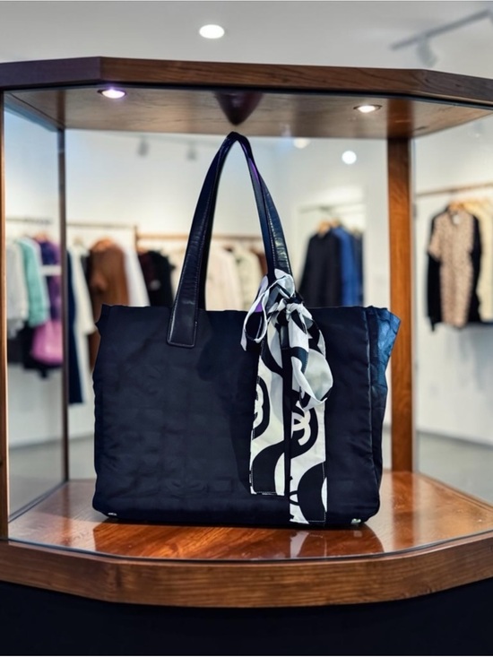 CHANEL Handbags - CHANEL Vintage Travel Line Tote MM 
Blk nylon/Jacquard w/Leather Handles (03/04)